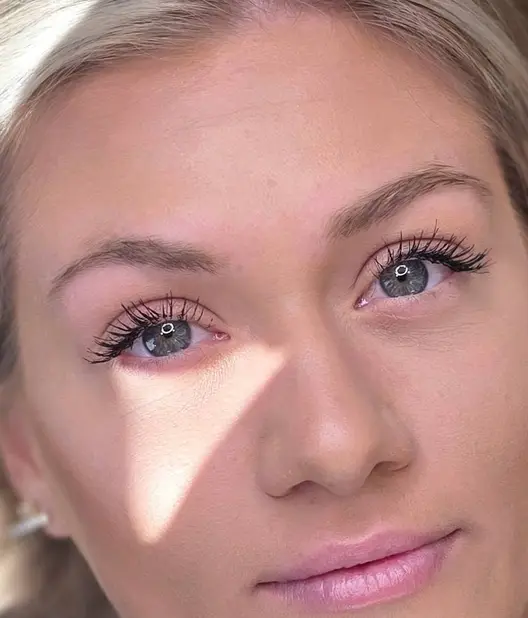 Before: the same client's lighter, sparser brows